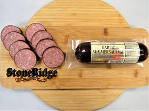 Garlic Summer Sausage - 12 Ounce Package on a cutting board.