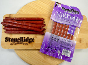 Teriyaki Meat Sticks  (7 ounces, 7 sticks) on a cutting board.