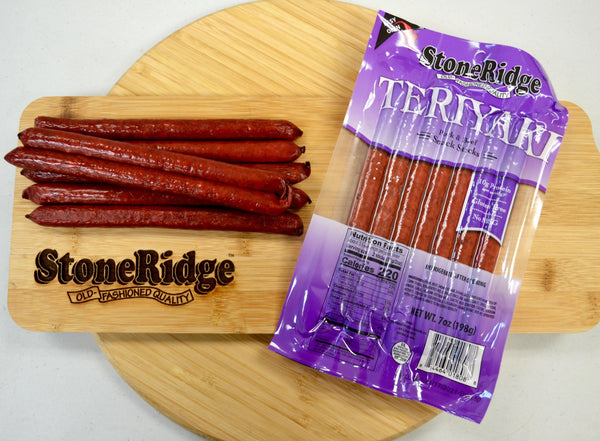 Teriyaki Meat Sticks  (7 ounces, 7 sticks) on a cutting board.
