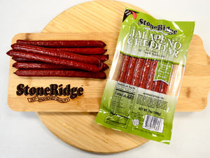 Jalapeno And Cheddar Meat Sticks  (7 ounces, 7 sticks) on a cutting board.