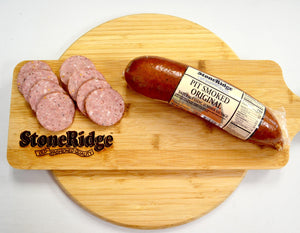 Pit Smoked Natural Casing Summer Sausage - 16 Ounce Package on a cutting board.