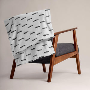 Throw Blanket  with StoneRidge Logo on a chair